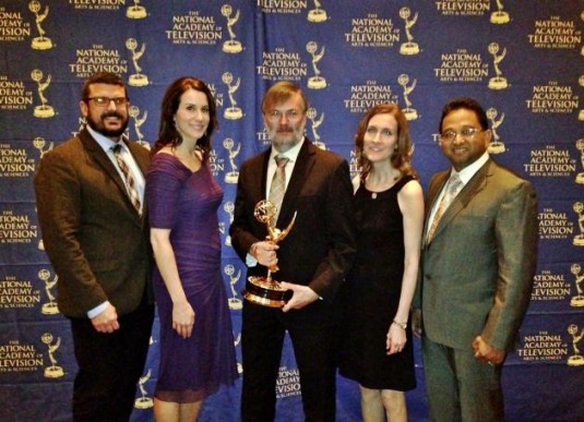 An Adobe team accepts the 2013 Technology and Engineering Emmy at a special ceremony at CES 2014 in Las Vegas.