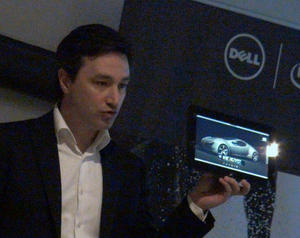 A Dell executive displays a tablet running remote workstation applications during its Paris presentation. (Source: CADplace)