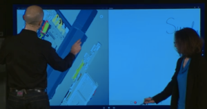 In their Surface Hub demonstration, Hayete Gallot works with a colleague as he explores a Siemens NX model of the Surface Hub and she picks up a stylus to make notes on a screen capture. (Source: Microsoft presentation). 
