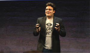 Palmer Luckey shows off the Half Moon controller prototypes. (Source: JPR)