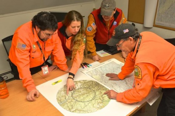 Large printed maps allow New Jersey Search and Rescue team members to quickly understand emergency situations.  (Source: HP) 