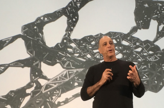 Autodesk CEO Carl Bass kicks off the REAL Conference with stories about getting out of the loop. Here he shows examples of generative software used to design a race car frame. (Source: Jon Peddie Research)