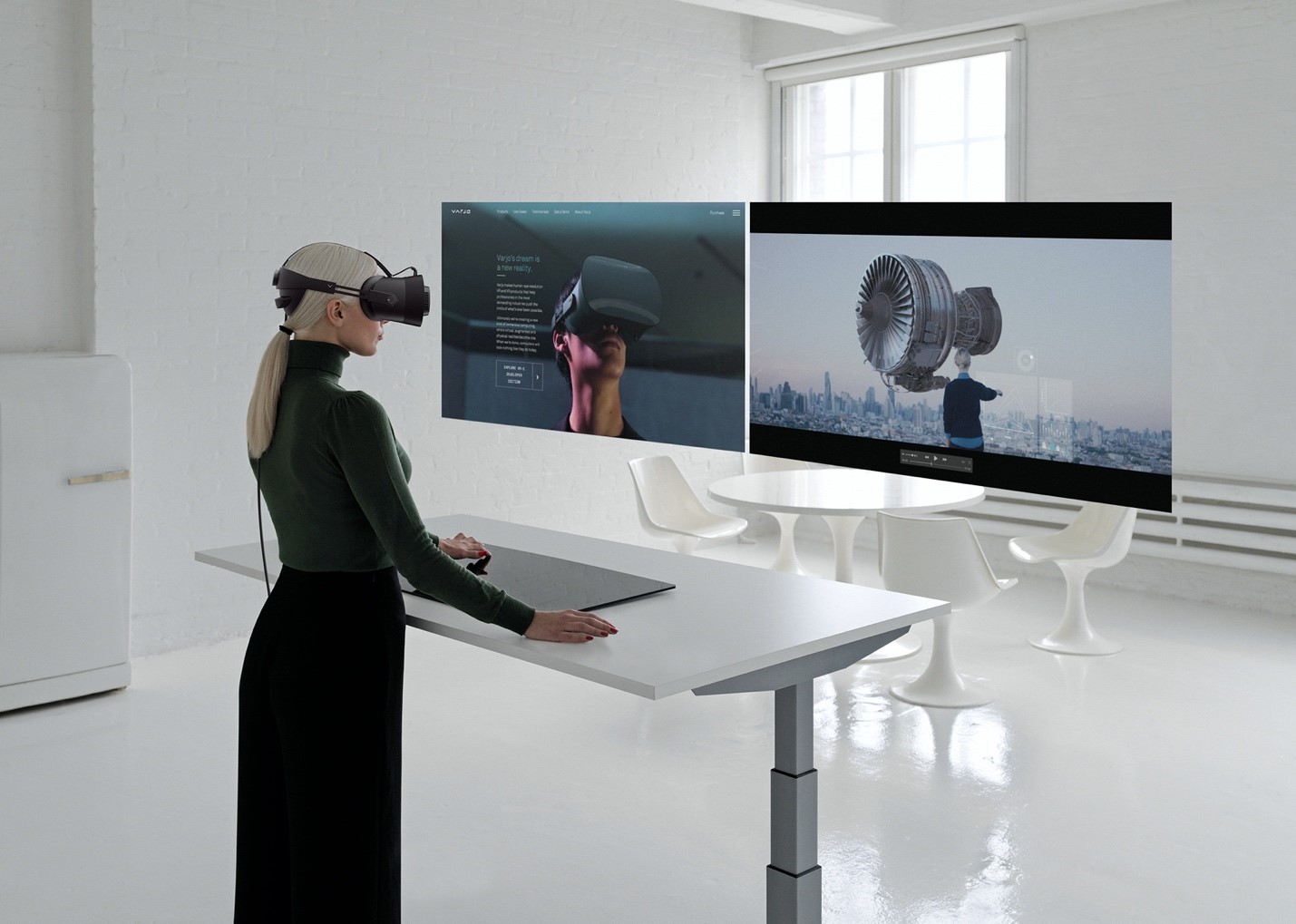 Women wearing Varjo headset at virtual workstation
